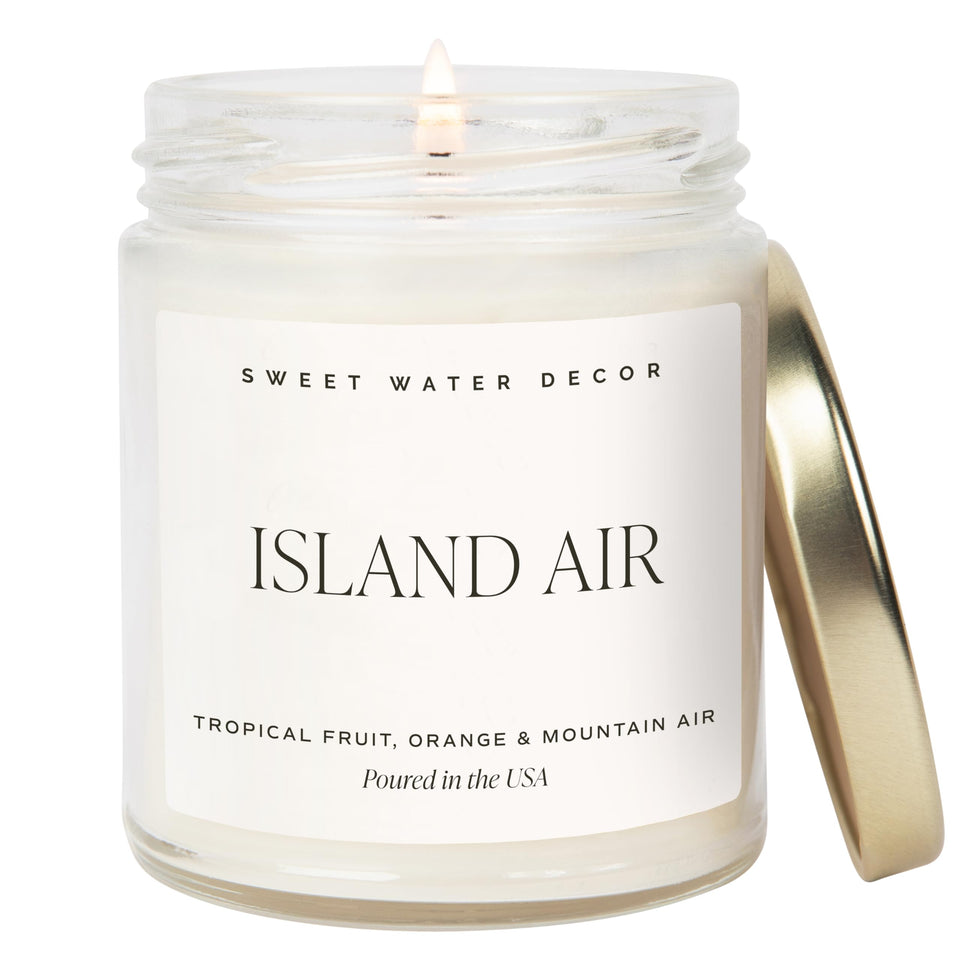 Sweet Water Decor Island Air candle with tropical fruit notes for a fresh, relaxing atmosphere.