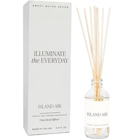 Sweet Water Decor Island Air reed diffuser setup enhances room ambiance.