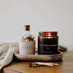 Room ambiance featuring the Sweet Water Decor Palo Santo Patchouli Candle.