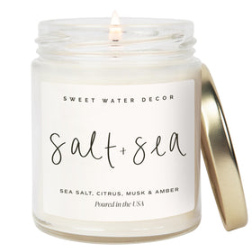 Sweet Water Decor Salt and Sea candle in a clear 9oz jar with gold lid, coastal focal point