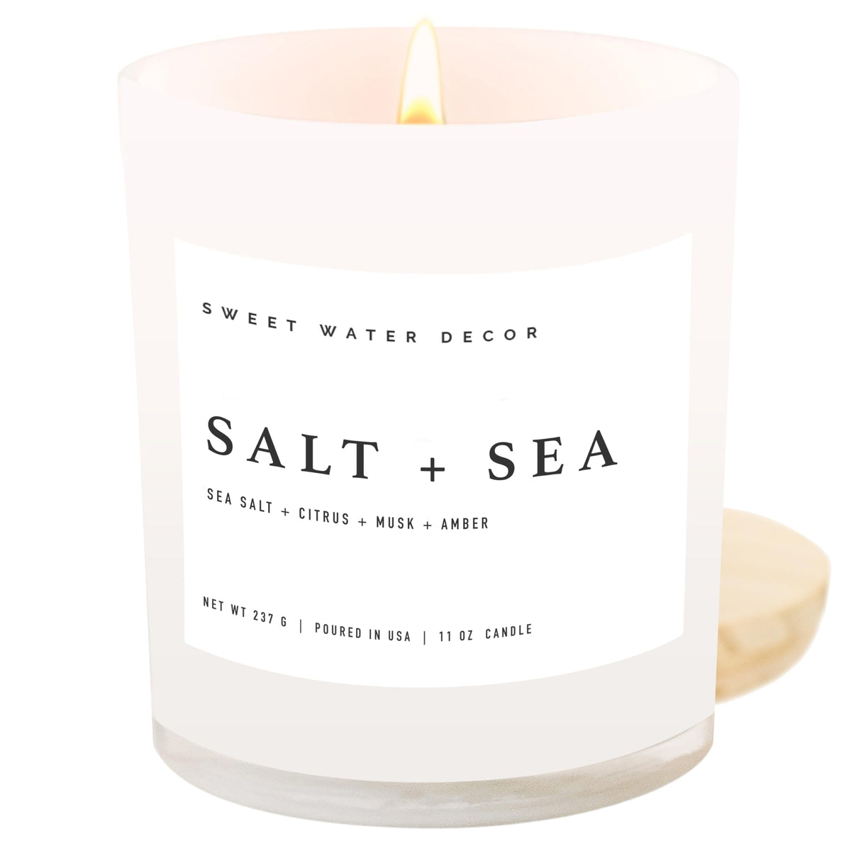 Sweet Water Decor Salt and Sea candle in a white jar adds coastal ambiance to any room