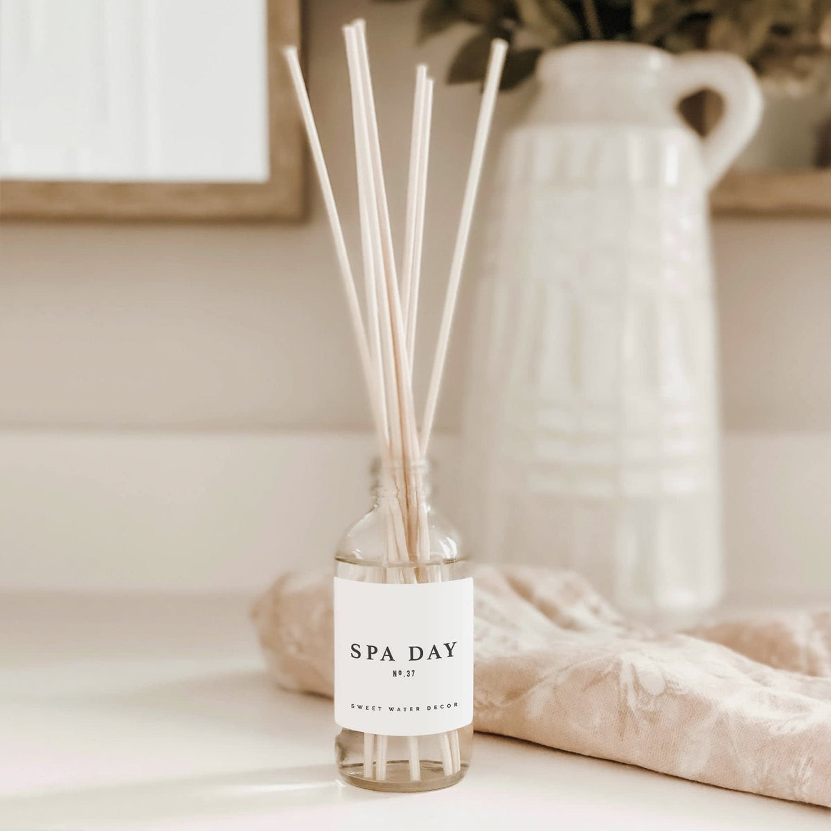 Sweet Water Decor Spa Day diffuser bottle cream scent adds gentle warmth.
