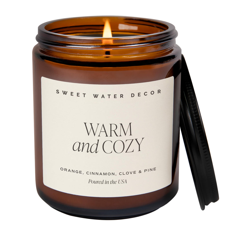 Sweet Water Decor warm cozy soy candle in amber jar enhances any room ambiance.