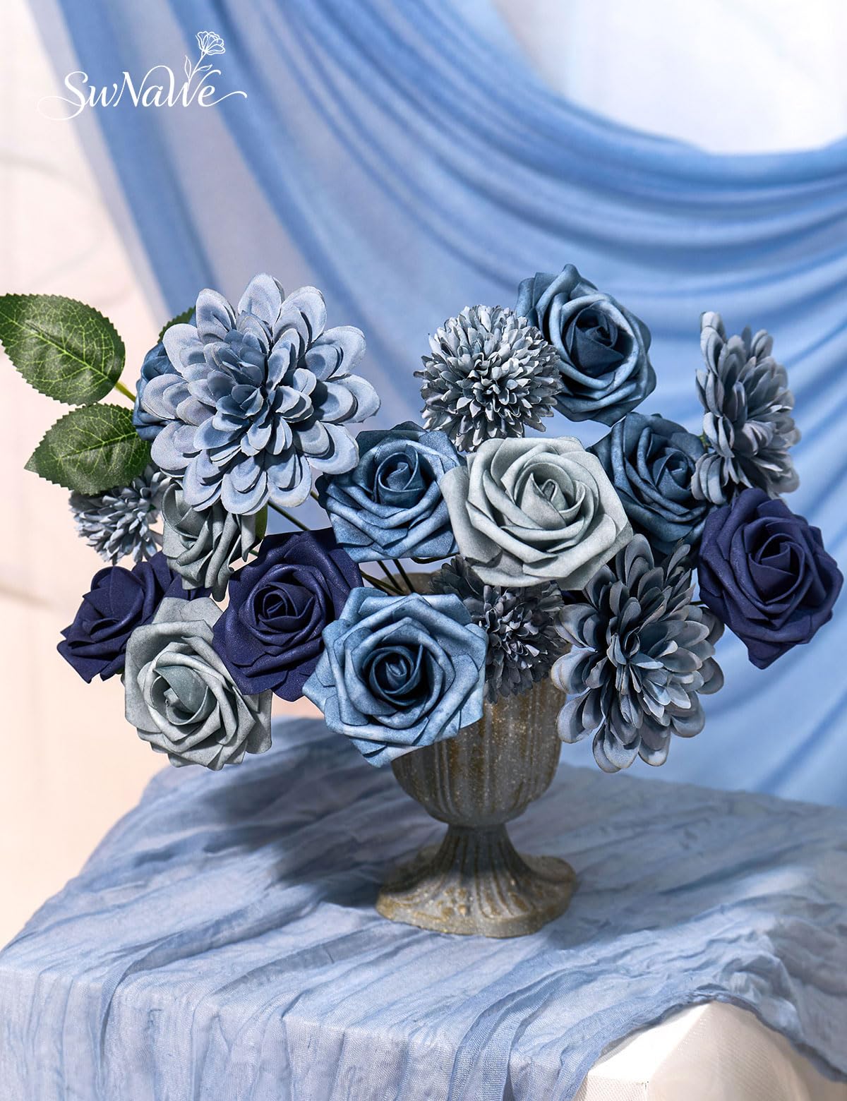 SWNAWE wedding centerpiece assembly with coordinated blues and greens.