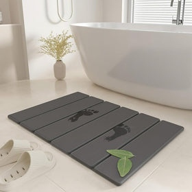 SYIPO stone bath mat with quick-dry surface keeps bathroom floors dry.
