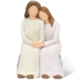 Symbullize mother-daughter resin figurine close-up with tender embrace for warm home decor.