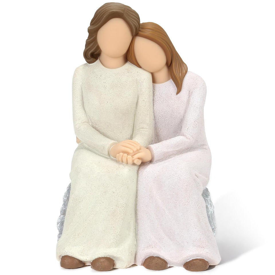 Symbullize mother-daughter resin figurine close-up with tender embrace for warm home decor.
