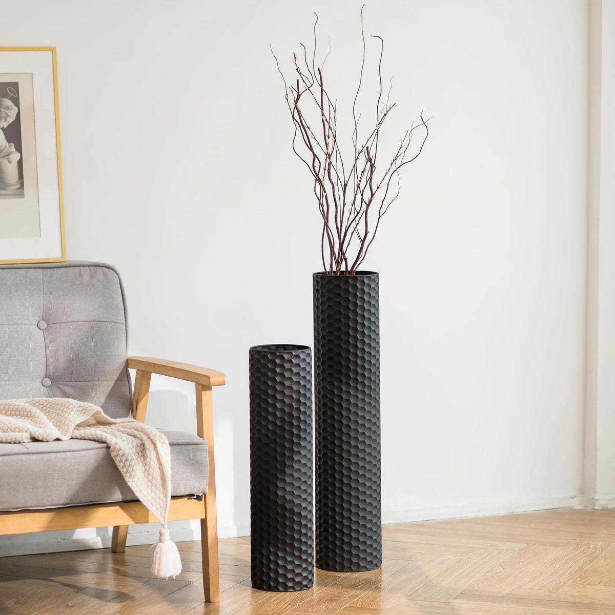 Sziqiqi black cylinder floor vase 27.6in enhances a bold, modern entryway focal point.