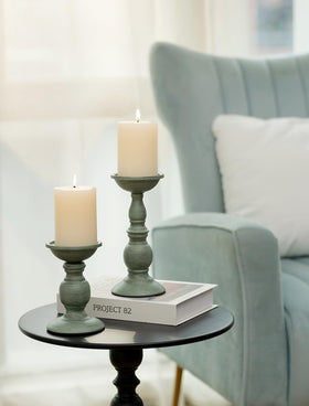 Sziqiqi candle holder base provides a stable display for pillar candles.