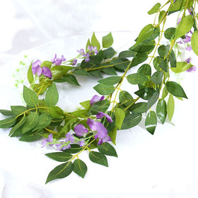 SzJias wisteria garland positioned on arch showing romantic drape.