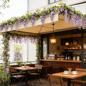 SzJias wisteria wedding arch decor for a lush entrance.