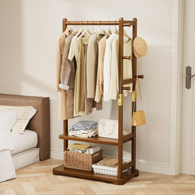 Taitiy coat rack with solid wood base ready for coats in a hallway