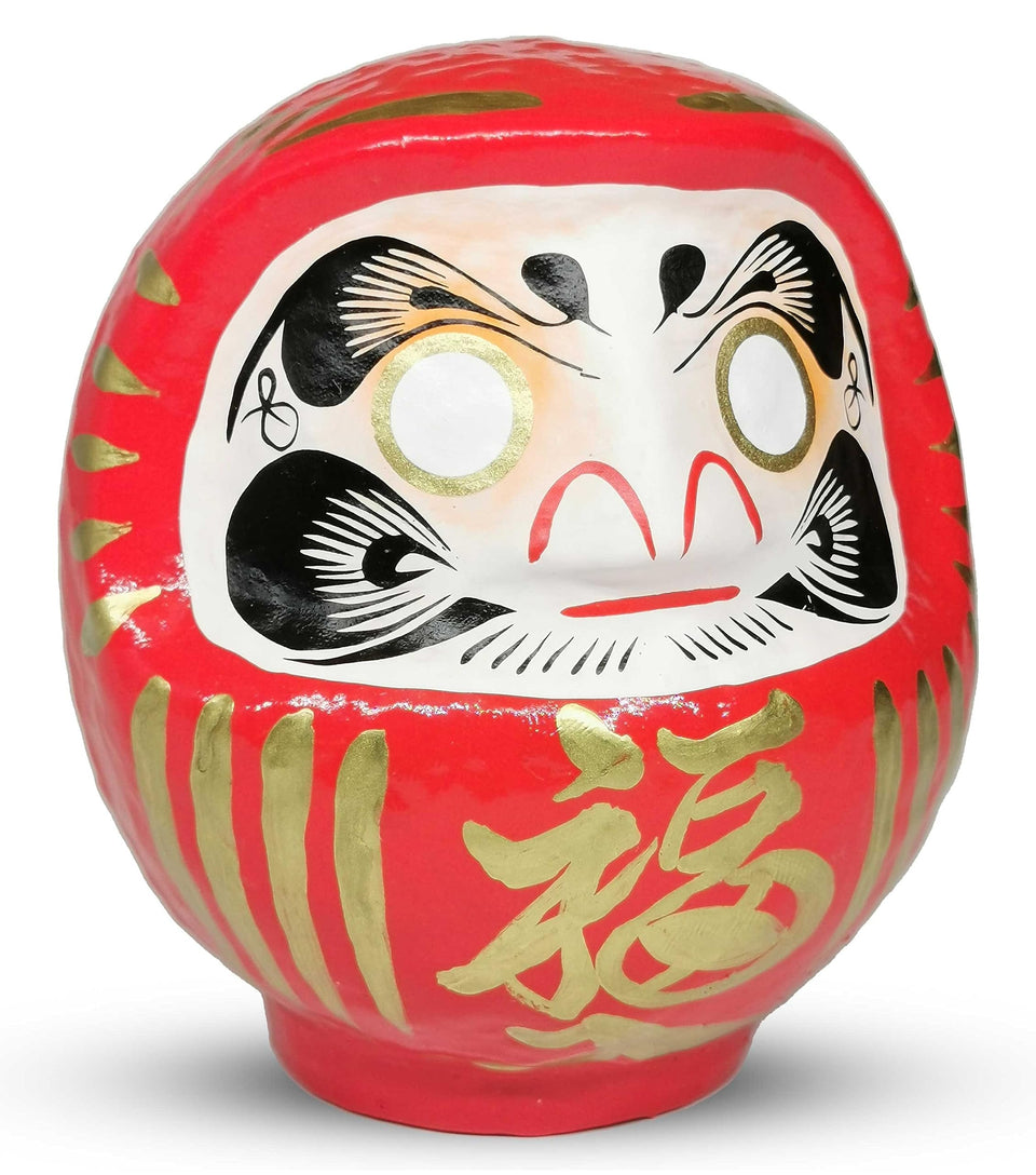 Takasaki Daruma red doll, front view, a traditional good luck symbol.
