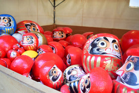 Takasaki Daruma red doll, gift-ready presentation for celebrations.