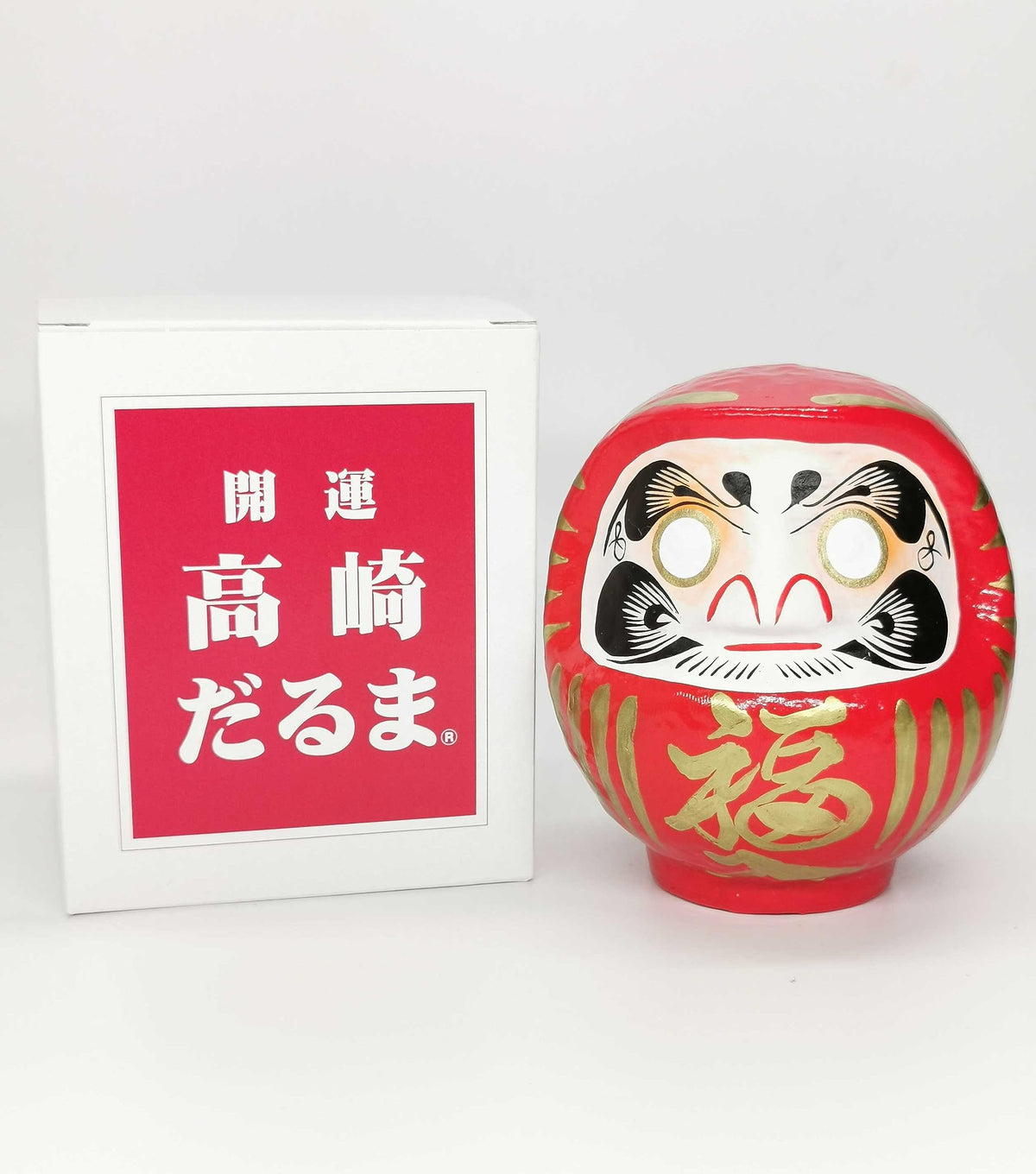 Takasaki Daruma red doll packaging, protective and gift-ready.