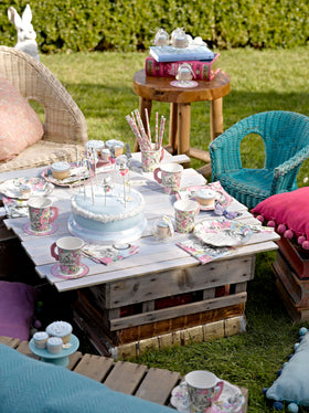 Talking Tables table arrangement for sixteen guests shows cohesive wonderland vibe.