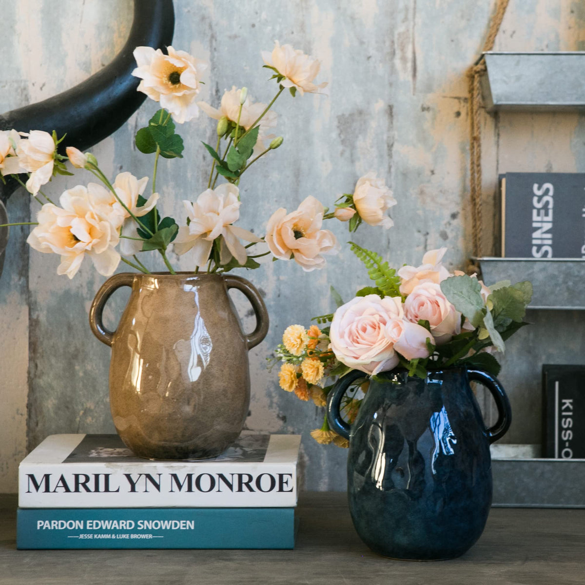 Tanvecle blue vase with faux flowers enhances living spaces.