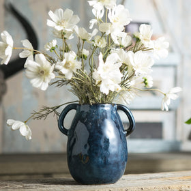 Tanvecle seven-inch decorative vase for fresh, dried, or faux flowers.