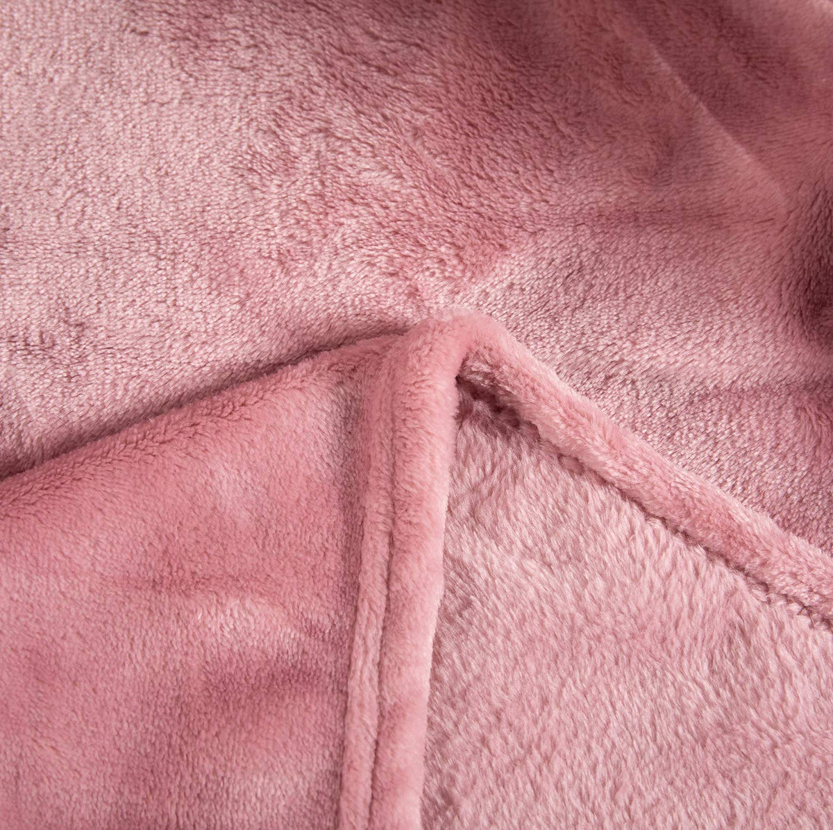 TASTHROW easy care guidance for machine wash and low heat drying.