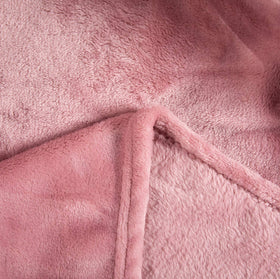 TASTHROW easy care guidance for machine wash and low heat drying.