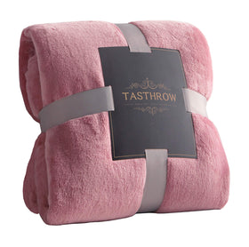 TASTHROW large pink flannel fleece throw on sofa for cozy lounging.