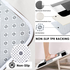 Tayney grey geometric u-shaped rug provides non-slip footing for safer bathroom routines.