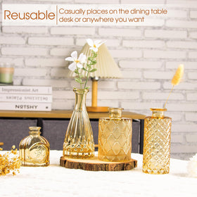 TBWIND textured amber glass vase catches light for a shimmering effect.