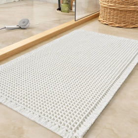 Tchdio waffle bath mat close-up showing absorbent texture for quick water pickup