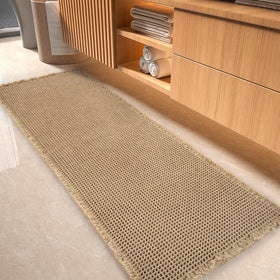 tchdio waffle bath mat with absorbent weave beside tub