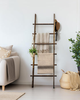 TEAKMAMA blanket ladder placed in living room enhancing decor and storage