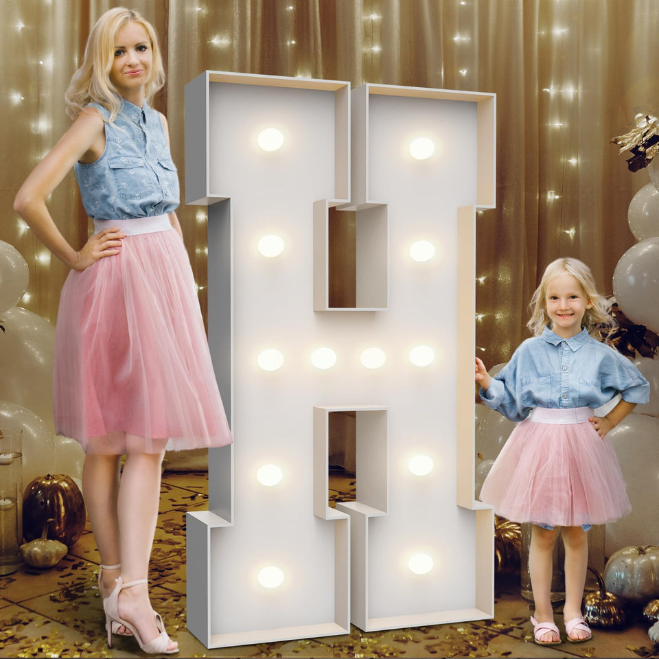 Teebloom H marquee light outdoors with weighted bag for stability.
