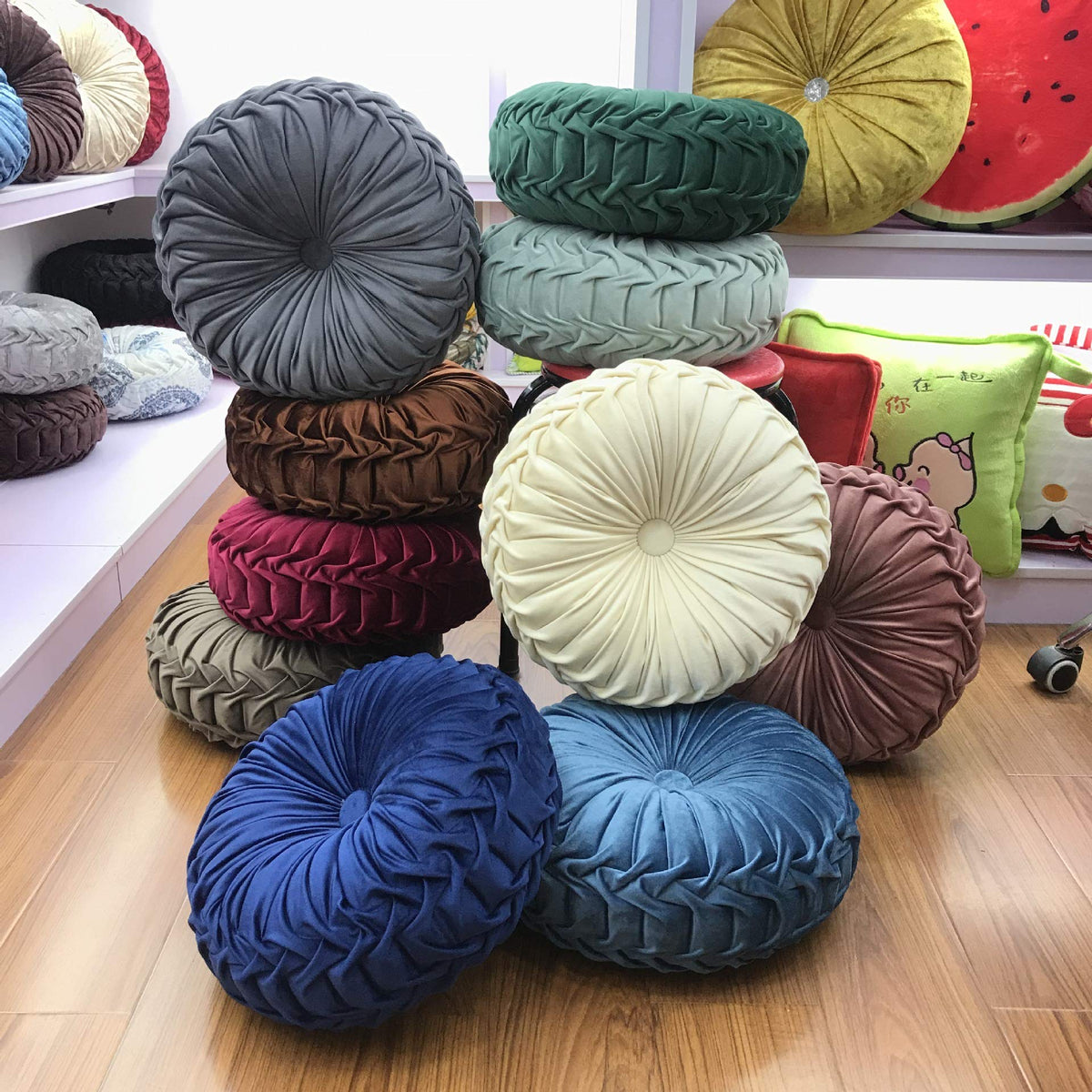 Teieas pleated round cushion offers elegant support for lounging at home.