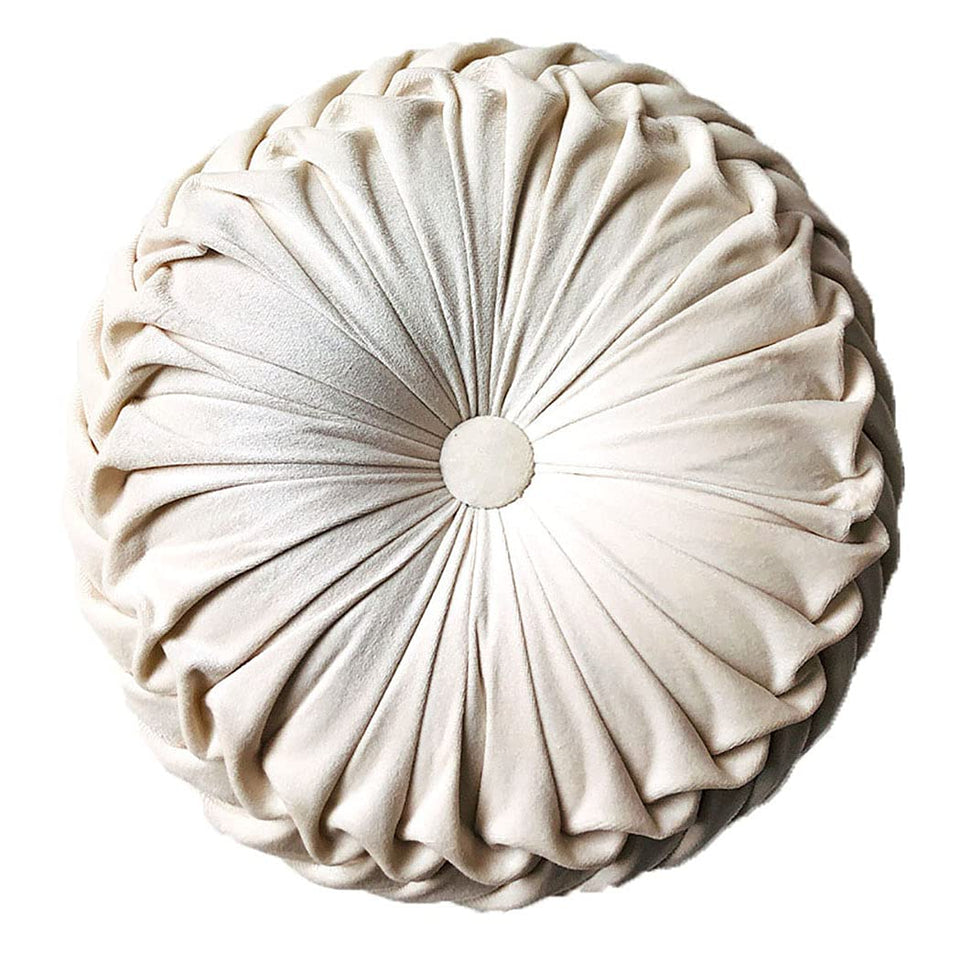 Teieas round velvet throw pillow with pleated beige design enhances sofa decor.