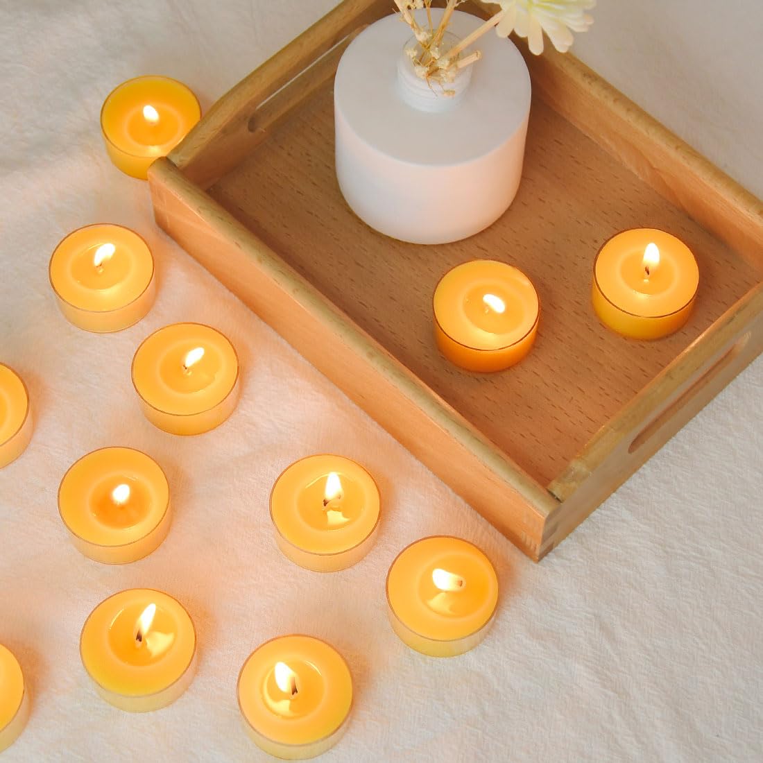 TELOSMA clean-burn tealight candles minimize waste with recyclable cups.