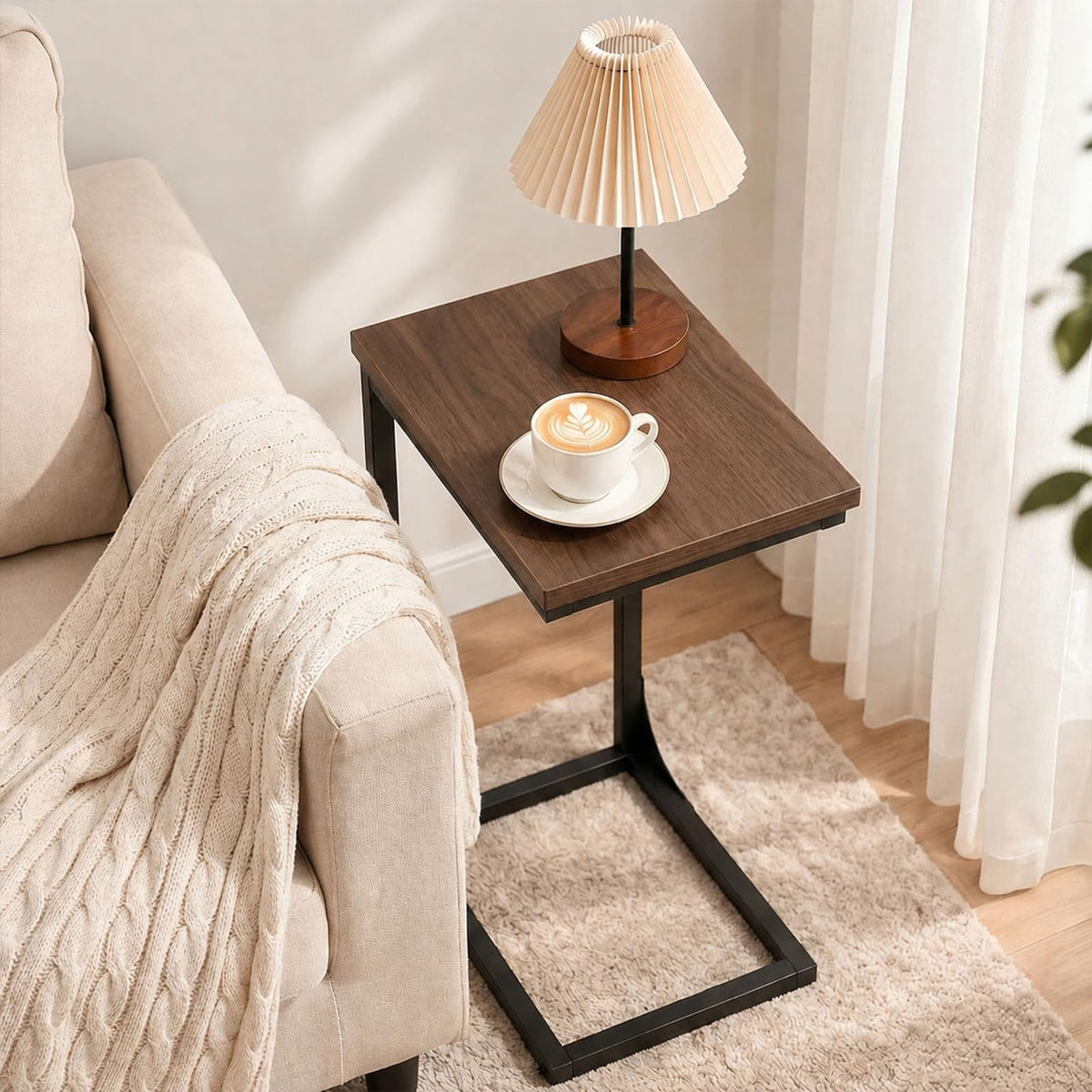 Adjustable feet on TEMI C-shaped end table help level on uneven floors.