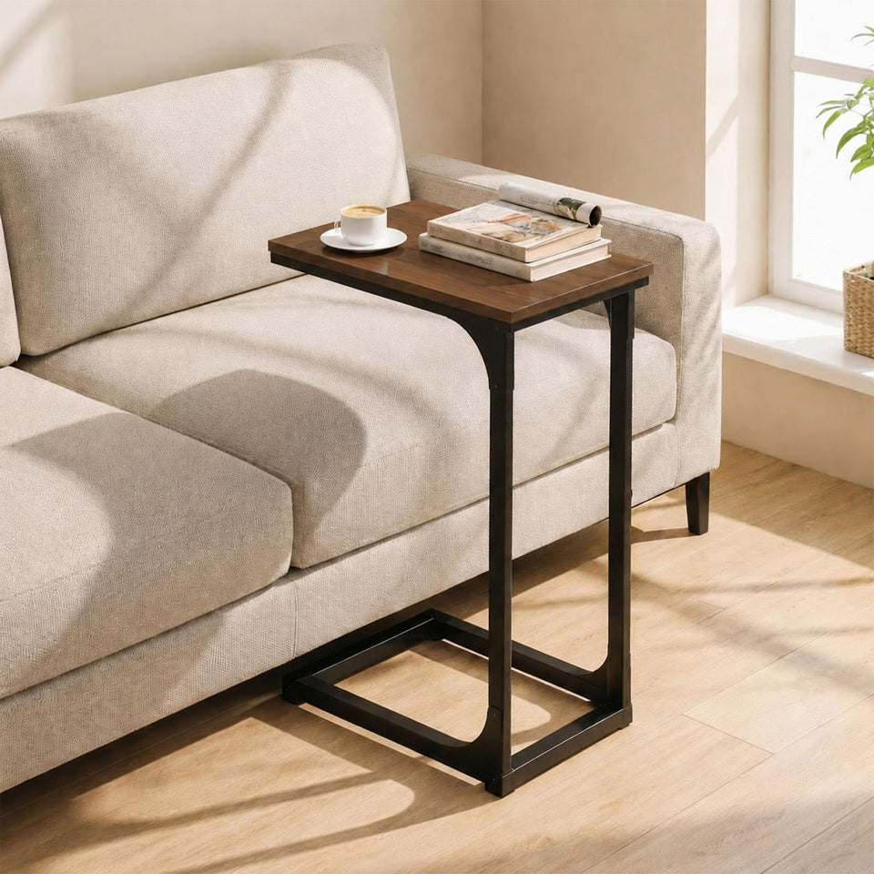 TEMI C-shaped end table tucked under a sofa for easy reach.