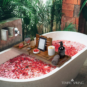 Temple Spring acacia wood bath caddy in natural finish for timeless bathroom style.