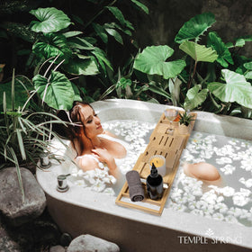 Temple Spring candle and snack compartments keep bath essentials organized.