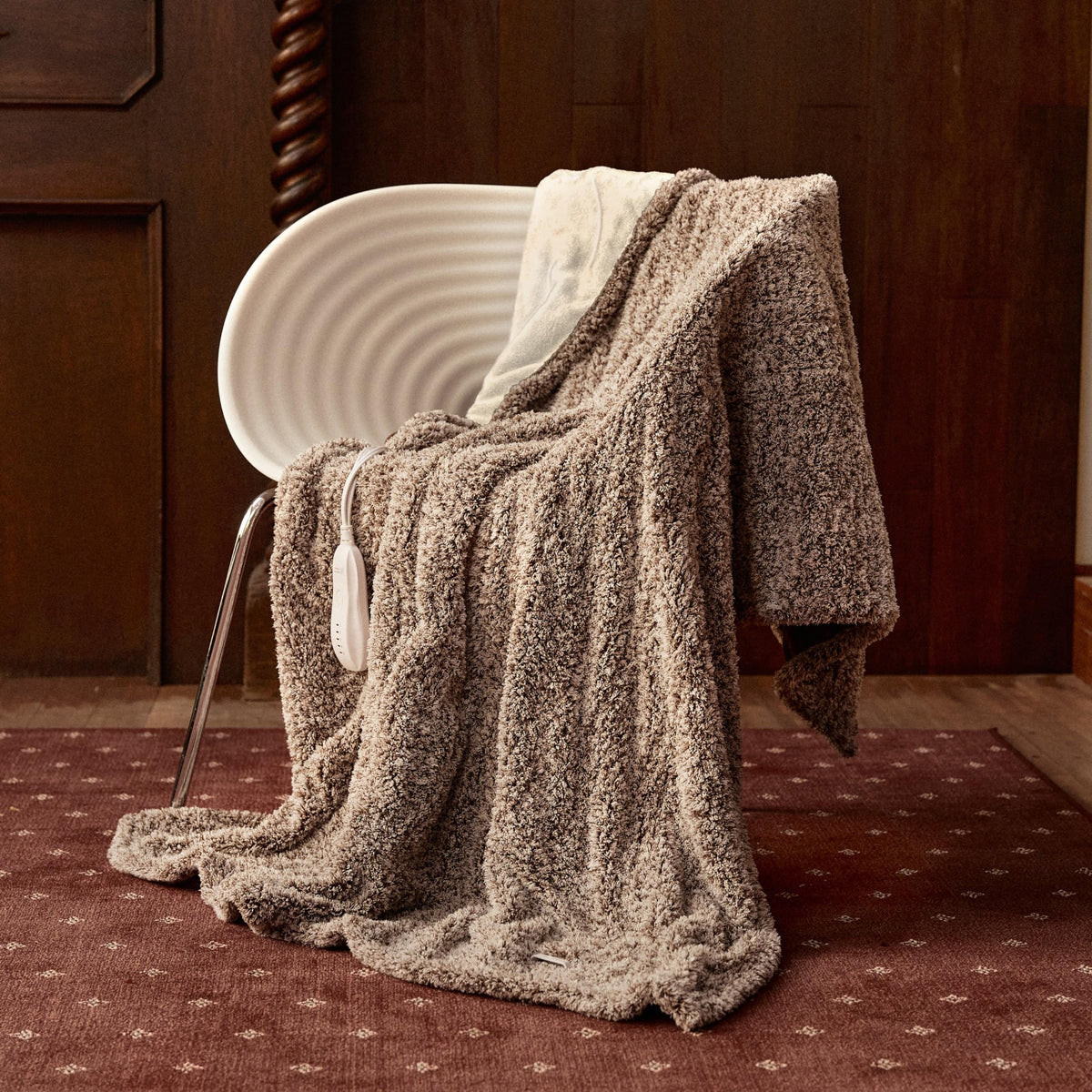 Templewet heated throw on bed for cozy warmth and relaxation