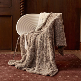 Templewet heated throw on bed for cozy warmth and relaxation