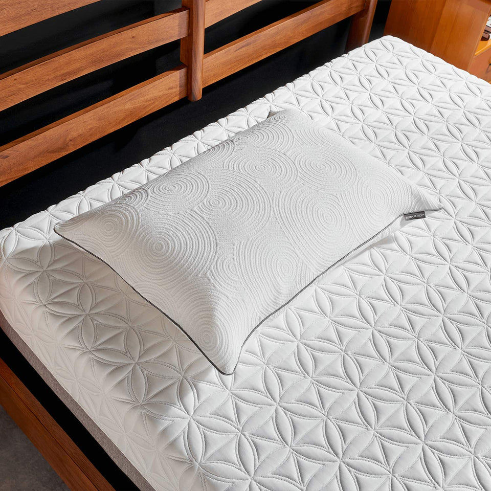 Tempur-Pedic Protect Pillow Protector in queen size guarding against spills for clean sleep.