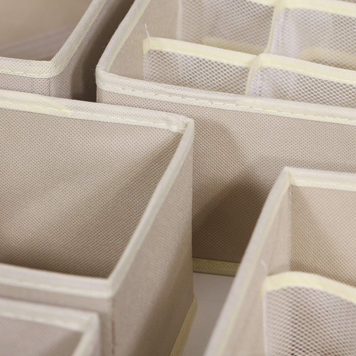 Tenabort multi-size beige drawer dividers help tidy small items at a glance.