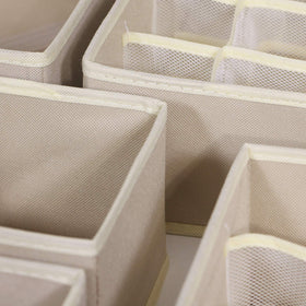 Tenabort multi-size beige drawer dividers help tidy small items at a glance.