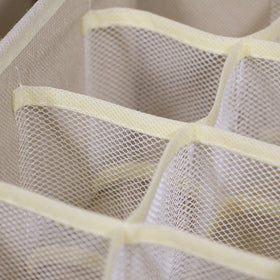 Tenabort underwear and sock organizers in beige keeping essentials visible.