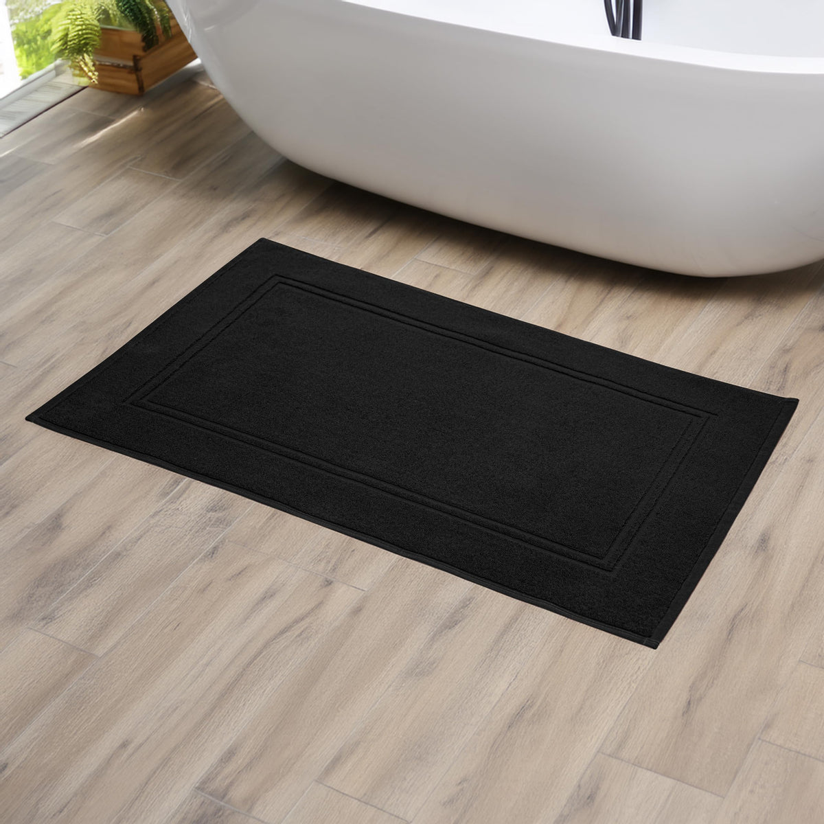 Tens Towels bath mat black color adds sleek hotel-quality styling