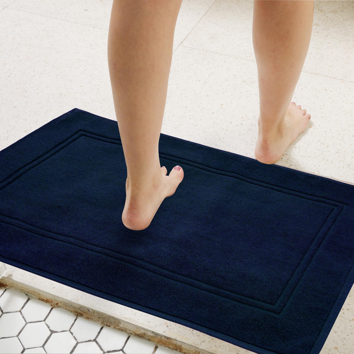 Tens Towels bath mat machine-washable design simplifies cleaning and care.
