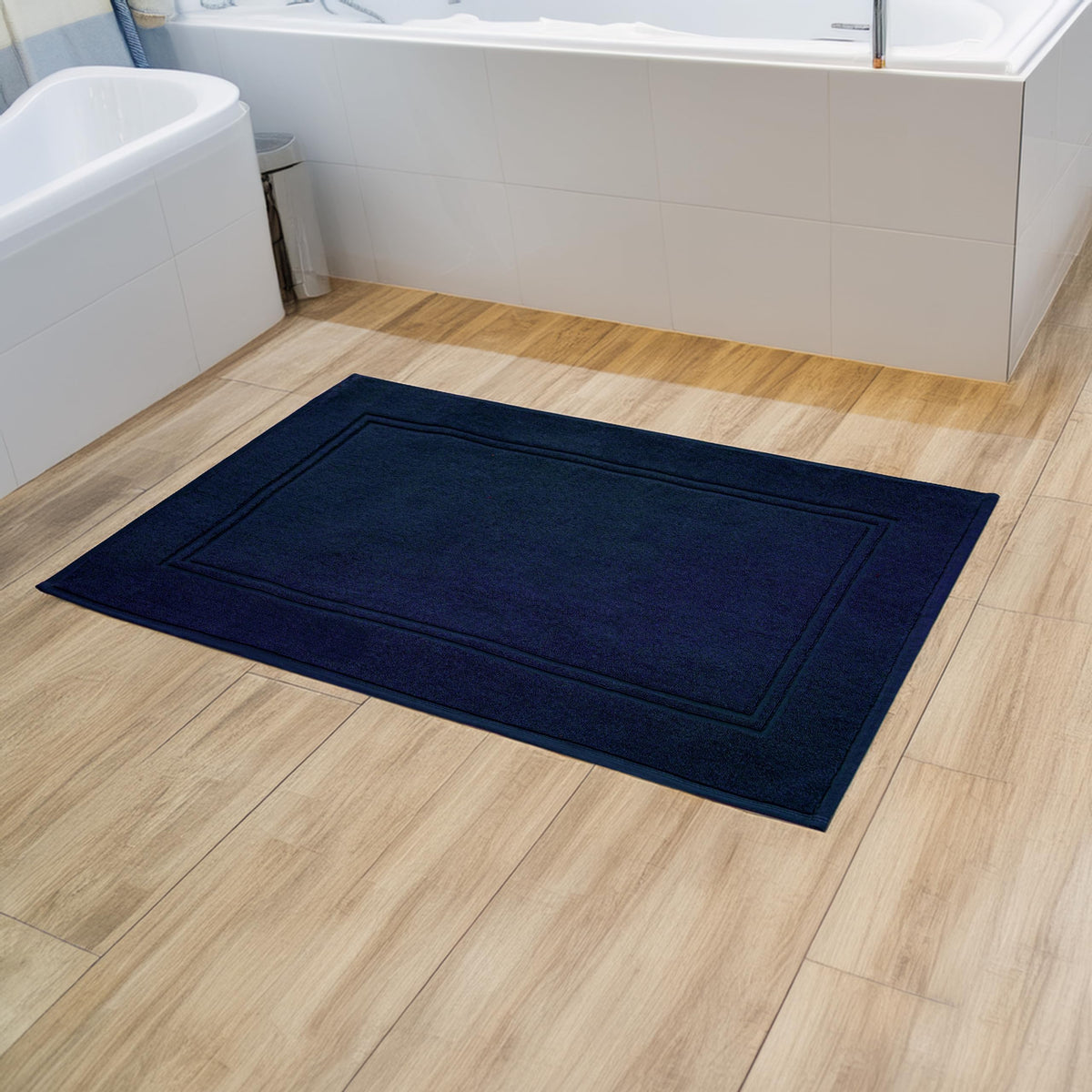 Tens Towels bath mat size-20x32 offers generous coverage beside tub or vanity.