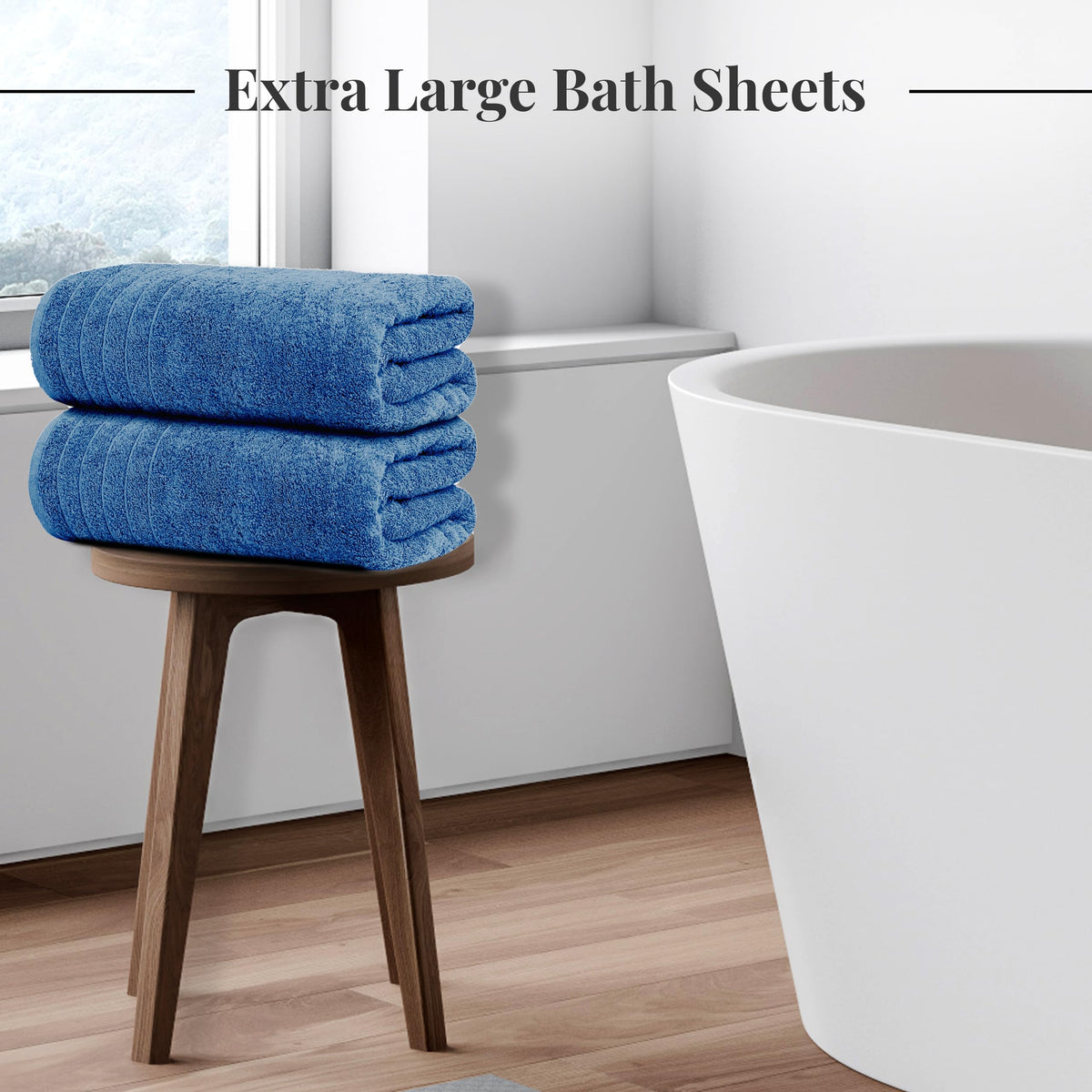 Tens Towels bath sheet 35x70 blue spread on bed, showing generous wrap.