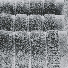 Tens Towels care instructions label indicates gentle washing for long-lasting softness.