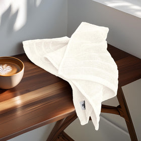 Tens Towels cream hand towels in a bathroom setting.